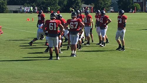 The Falcons held their first padded practice of training camp on Saturday. (By D. Orlando Ledbetter/dledbetter@ajc.com)