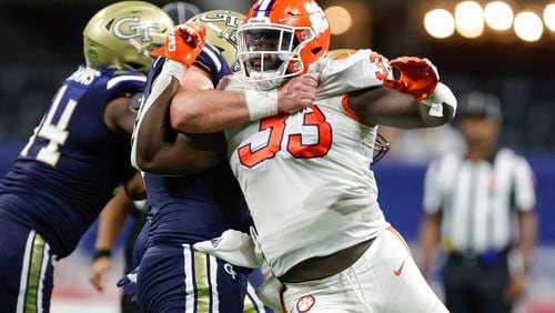 Clemson's Ruke Orhorhoro (33) is blocked by Georgia Tech's Weston Franklin (72) during the second half of an NCAA football game on Monday, Sept. 5, 2022, in Atlanta. (AP Photo/Stew Milne)