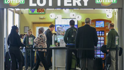 SECONDARY PHOTO - January 12, 2016 Hartsfield-Jackson International Airport : Lines formed outside at the Georgia Lottery Airport South Kiosk at Hartsfield-Jackson International Airport on Tuesday,  Jan. 12, 2016 as the record-breaking Powerball jackpot continued to climb, hitting $1.5 billion ahead of Wednesdays' drawing, according to the Georgia Lottery. Players who would take the cash option would win $930 million, before taxes. Winning isn't everything, though, and players should expect a barrage of con artists, lawsuit filers and taxes when they win. Remember, though, even if Wednesday's drawing fails to declare a winner, the children are the real winners. Since Powerball began rolling over on Nov. 7, the jackpot has generated an estimated $26.9 million for Georgia Lottery-funded Pre-K and HOPE Scholarships. Players have had until 10 p.m. Wednesday to buy $2 tickets, according to lottery officials. The drawing was held at 11 p.m. EST. and the result not available at the time of this report. JOHN SPINK /JSPINK@AJC.COM