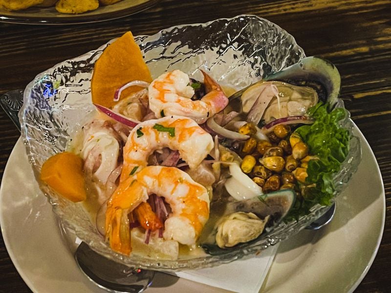 The ceviche mixto at Pisco Latin Kitchen contains white fish, shrimp, mussels, squid and octopus, served with slices of cooked sweet potato. Henri Hollis/henri.hollis@ajc.com