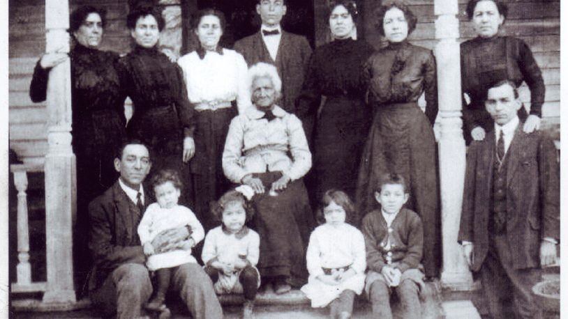 Kittie Simkins and William Ramey had nine children. Their great-great-great granddaughter, Paula Wright, was able to locate the only surviving image of the family gathered on the front porch of the family home on the day of Ramey’s funeral in 1913. CONTRIBUTED BY PAULA WRIGHT