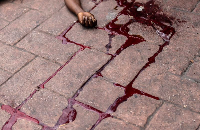 The body of a man shot dead lies in a pool of blood in the Petion-Ville neighborhood of Port-au-Prince, Haiti, Friday, May 3, 2024. (AP Photo/Ramon Espinosa)