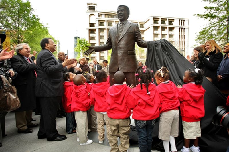 The 8.5-foot bronze statue of Andrew Young was created by North Carolina sculptor Johnpaul Harris at Walton Spring Park. John Spink/AJC FILE