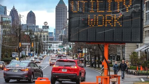 On Monday, the Georgia Department of Transportation and Georgia Power began readjusting the placement of 100 utility poles from the curb to the back of the sidewalk along the popular Midtown Road.