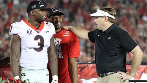 Kirby Smart stands on stage with Roquan Smith and Nick Chubb after beating Oklahoma 54-48 during double over time in the College Football Playoff Semifinal at the Rose Bowl Game on Monday, January 1, 2018, in Pasadena.    Curtis Compton/ccompton@ajc.com