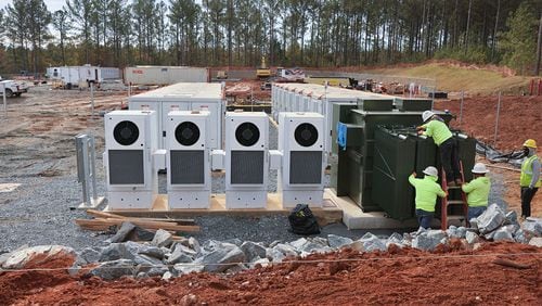 Workers install a new battery energy storage system that Georgia Power is constructing and bringing online in Columbus on Nov. 14. (Natrice Miller/Atlanta Journal-Constitution/TNS)