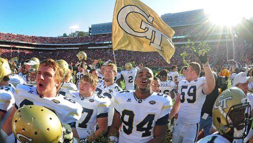 Members of the Georgia Tech Yellow Jackets celebrate after the game against the Georgia Bulldogs at Sanford Stadium on November 26, 2016 in Athens, Georgia. (Photo by Scott Cunningham/Getty Images)