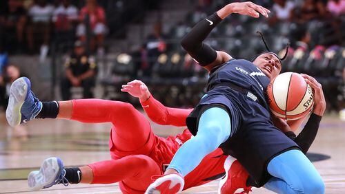 Atlanta Dream guard Brittney Sykes is leveled by Washington Mystics guard Natasha Cloud for a foul during the first half in a WNBA semifinal playoff game on Sunday, August 26, 2018, in Atlanta.   Curtis Compton/ccompton@ajc.com