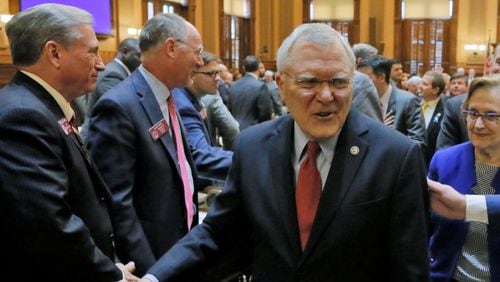 Gov. Nathan Deal exits the House chamber after he outlined his agenda in his final State of the State speech before a joint session of the General Assembly. BOB ANDRES /BANDRES@AJC.COM