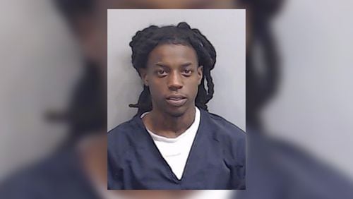 LeParis Dade, 24, also known as OMB Peezy, was booked into the Fulton County Jail on charges of aggravated assault with a deadly weapon and possession of a firearm during the commission of a crime.