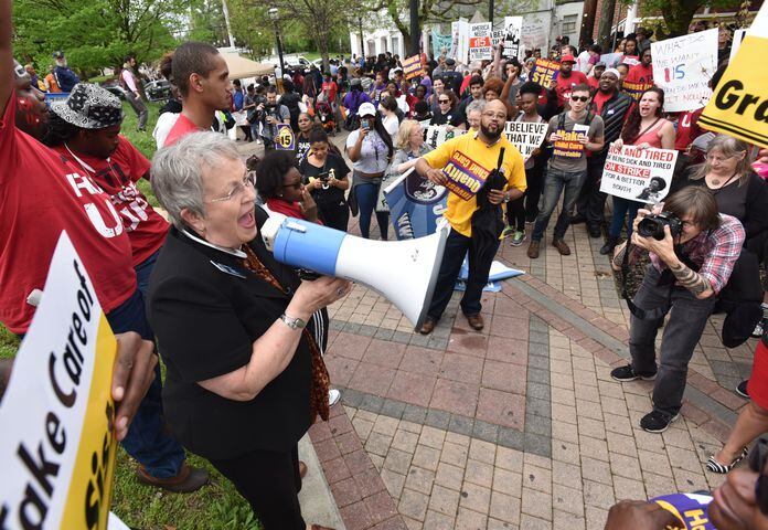 Hundreds protest low wages