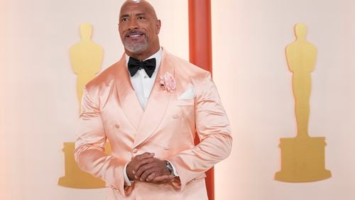 Dwayne Johnson arrives at the Oscars on Sunday, March 12, 2023, at the Dolby Theatre in Los Angeles. (AP Photo/Ashley Landis)