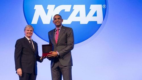 NCAA president Mark Emmert presents Hawks vice chairman  Grant Hill with the 2017 NCAA President’s Gerald R. Ford Award early this year.