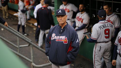 Atlanta Braves interim manager Brian Snitker stands in the dugout before a baseball game against the Pittsburgh Pirates in Pittsburgh, Tuesday, May 17, 2016. (AP Photo/Gene J. Puskar)