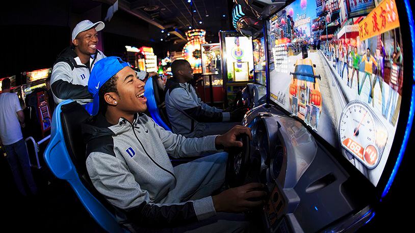 Duke players enjoyed some laughs in the Dave & Buster's game room.