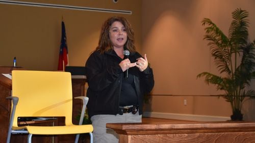 Joanne Southerland, an advocate for victims of human trafficking from the Clayton County Fire and Emergency Services, discusses the impact of forced labor and sex trafficking at a meeting Thursday in Henry County. PHOTO: LEON STAFFORD