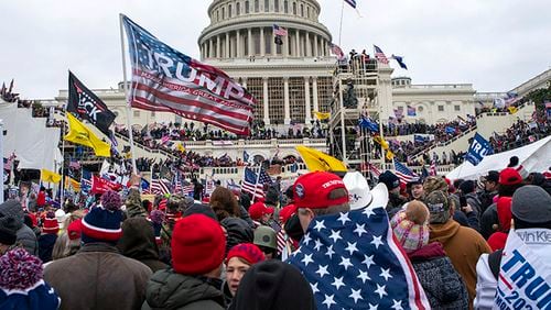 FILE - Rioters loyal to President Donald Trump rally at the U.S. Capitol in Washington on Jan. 6, 2021. A new poll shows that a year after the deadly Jan. 6 insurrection at the U.S. Capitol, only about 4 in 10 Republicans recall the attack by supporters of former President Donald Trump as very violent or extremely violent. A new poll shows that a year after the deadly Jan. 6 insurrection at the U.S. Capitol, only about 4 in 10 Republicans recall the attack by supporters of former President Donald Trump as very violent or extremely violent. (AP Photo/Jose Luis Magana, File)