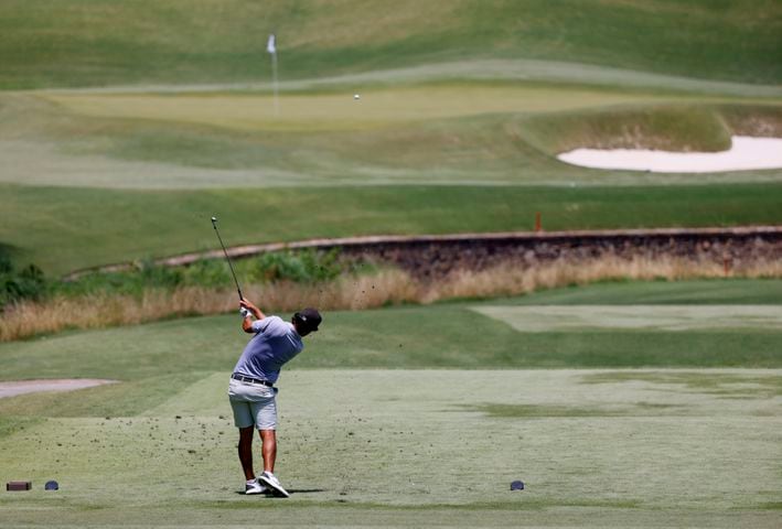 Scotty Kennon, Wake Forest University, who finished second, hits off the eighth tee during the final round of the Dogwood Invitational Golf Tournament in Atlanta on Saturday, June 11, 2022.   (Bob Andres for the Atlanta Journal Constitution)