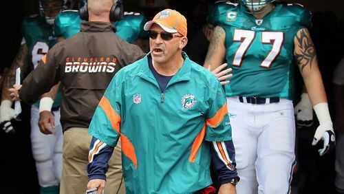 Miami Dolphins head coach Tony Sparano leads the team on to the field against the Browns on Sept. 25, 2011. (Allen Eyestone/The Palm Beach Post)