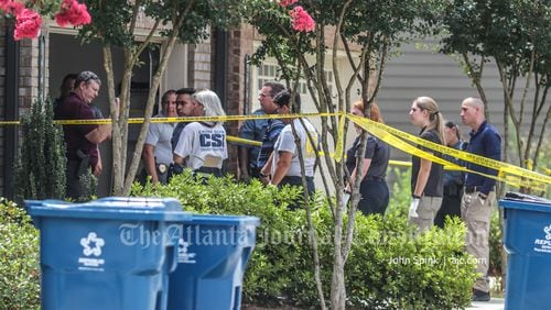 Gwinnett County homicide detectives were called to the scene Monday afternoon on Braemore Mill Drive.