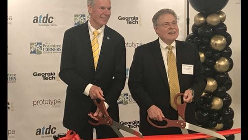 Georgia Tech president G.P. "Bud" Peterson (left) and Peachtree Corners Mayor Mike Mason (right) at a ribbon-cutting ceremony on Thu., Aug. 2, 2018 to unveil a bootcamp program that will begin in the city in January 2019. ERIC STIRGUS / ESTIRGUS@AJC.COM