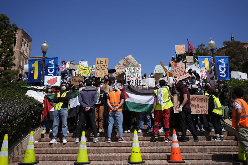 Demonstrators gather on the UCLA campus, after nighttime clashes between Pro-Israel and Pro-Palestinian groups, Wednesday, May 1, 2024, in Los Angeles. (AP Photo/Jae C. Hong)