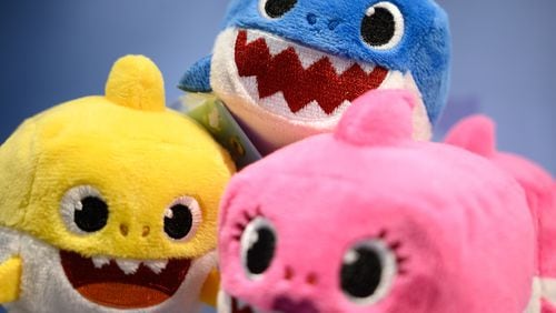 A selection of "Baby Shark" toys are seen on a display at the annual "Toy Fair" at Olympia London on January 22, 2019 in London, England. A California dad says he taught his 2-year-old daughter to do chest compressions, and says "Baby Shark" can be a great teaching tool.