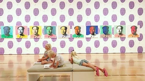 Three children take in the sights of the Andy Warhol exhibit at the High Museum.