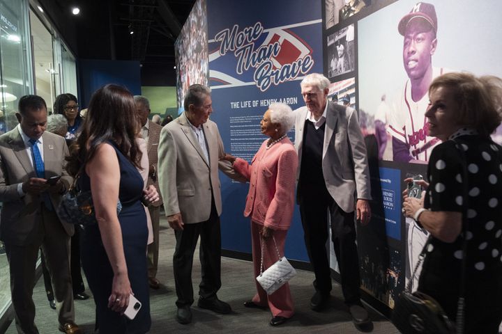 Billye Aaron talks with a member of the Braves 1974 team during the opening of the Atlanta History Center exhibit “More Than Brave: The Life of Henry Aaron” on Monday, April 8, 2024.   (Ben Gray / Ben@BenGray.com)