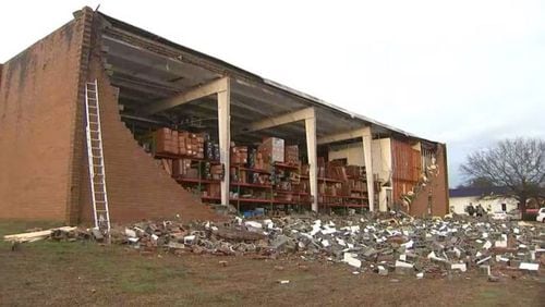 A wall was pulled down on one side of an auto parts warehouse in Austell on Thursday afternoon, Cobb County officials said.