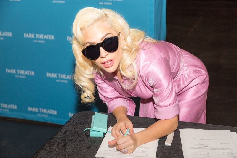 Lady Gaga signs the contract that finalizes her two-year engagement at Park MGM beginning in December 2018.