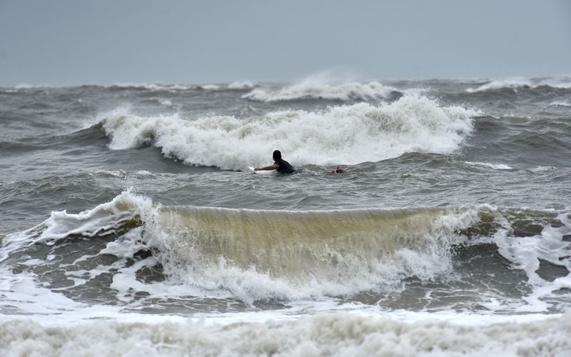 September 4, 2019 Tybee Island - A surfer hit the waves here Wednesday as Hurricane Dorian approached. (Hyosub Shin / Hyosub.Shin@ajc.com)