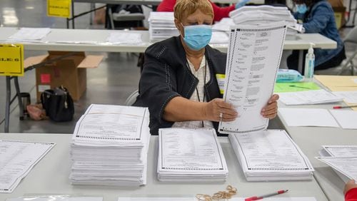 Dekalb election workers sort presidential ballots in Stonecrest Saturday, November 14, 2020. (Steve Schaefer/Atlanta Journal-Constitution/TNS)