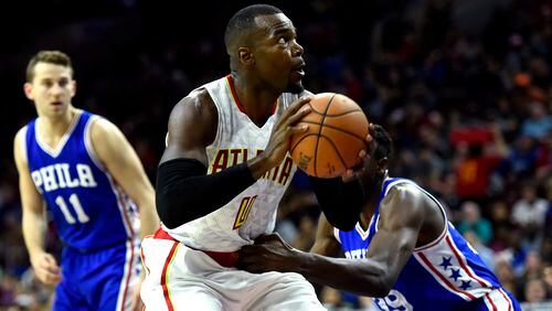 Atlanta Hawks' Paul Millsap (4) drives to the basket past Philadelphia 76ers' Jerami Grant (39) and Nik Stauskas (11) during the second half of an NBA basketball game, Saturday, Oct. 29, 2016, in Philadelphia. Millsap scored 17 points to lead five Hawks in double figures as Atlanta routed the 76ers 104-72. (AP Photo/Michael Perez)