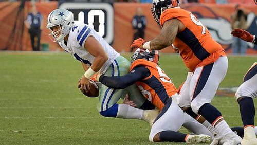 Dallas Cowboys quarterback Dak Prescott (4) is sacked by Denver Broncos outside linebacker Von Miller (58) during the fourth quarter as the Denver Broncos beat the Dallas Cowboys 42-17 on Sunday, Sept. 17, 2017 at Sports Authority Field at Mile High in Denver, Colo. (Max Faulkner/Fort Worth Star-Telegram/TNS)