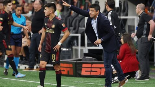 Atlanta United coach Gonzalo Pineda gives directions to midfielder Thiago Almada during the second half of an MLS soccer game at the Mercedes Benz Stadium on May 15, 2009. Sunday, May 15, 2022. Miguel Martinez / miguel.martinezjimenez@ajc.com