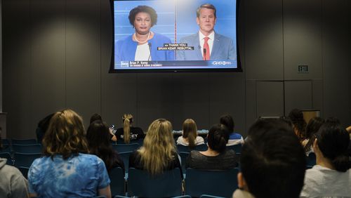 Students attend a watch party to see the gubernatorial debate between Democratic challenger Stacey Abrams, Libertarian challenger Shane Hazel and Georgia Republican Gov. Brian Kemp, at Emory University, Atlanta, on Oct. 17, 2022. (Gabriela Bhaskar/The New York Times)