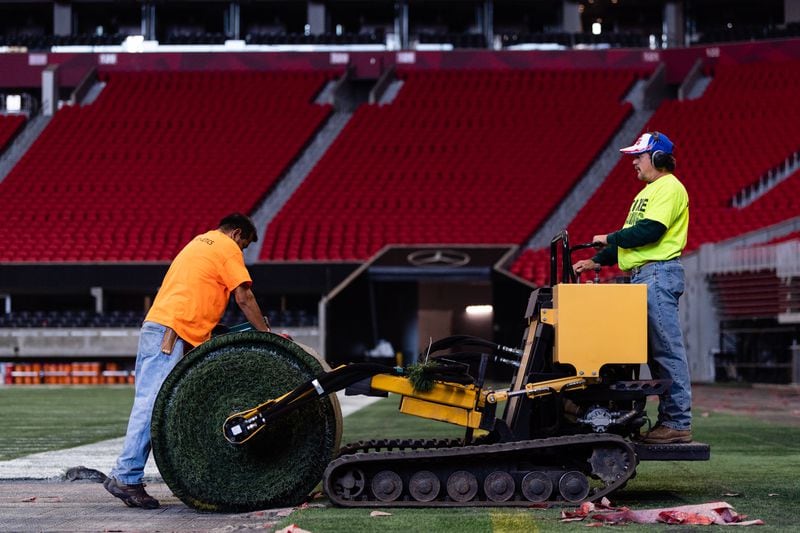 Work began Thursday on removing (and eventually replacing) the artificial turf at Mercedes-Benz Stadium. (Photo by Dakota Williams/AMB Sports & Entertainment)