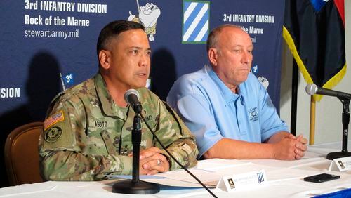 Army Maj. Gen. Antonio Aguto, left, and Army accident investigator Michael Barksdale hold a news conference at Fort Stewart, Ga., about a training accident that killed three soldiers and injured three others. Aguto said the soldiers' armored vehicle rolled off a bridge and landed upside down in a stream during a training exercise being conducted before dawn. The cause of the deadly crash is being investigated.