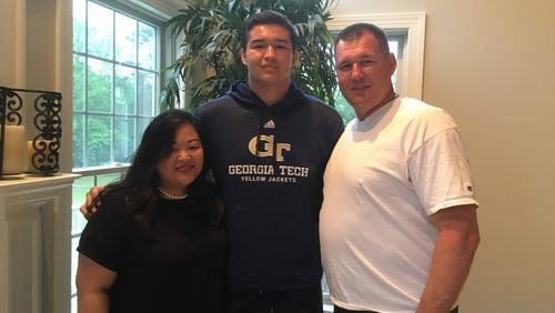 Georgia Tech freshman tight end Dylan Deveney with his parents Fran and George Deveney at their home in Medford, N.J. "We're excited," Fran said of Dylan attending Tech. "It's a plane ride away, but we think it's great." (AJC photo by Ken Sugiura)
