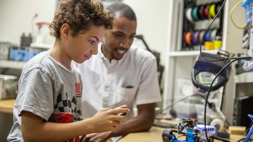 A student and his mentor test a robot at Big Brothers Big Sisters of Metro Atlanta, which received a grant through the Greater Atlanta COVID-19 Response and Recovery Fund for mentoring with a focus on both academic and social emotional support. Courtesy of The Community Foundation for Greater Atlanta