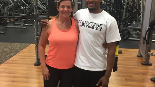 Janet Stallings at 145 pounds in October. With her is Justin Hunt, her personal trainer at Anytime Fitness in Towne Lake. (Justin Hunt)