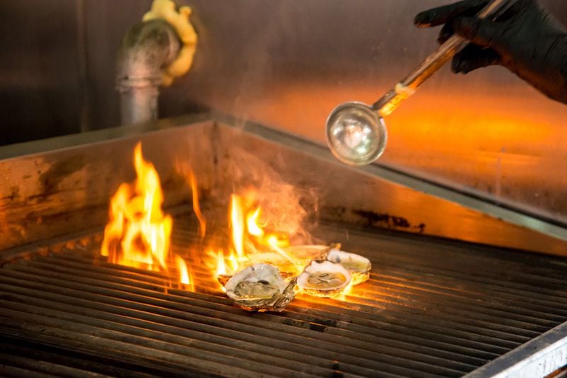 Oysters on the grill at Black Sheep Tavern and Oyster Room. Photo credit- Mia Yakel.