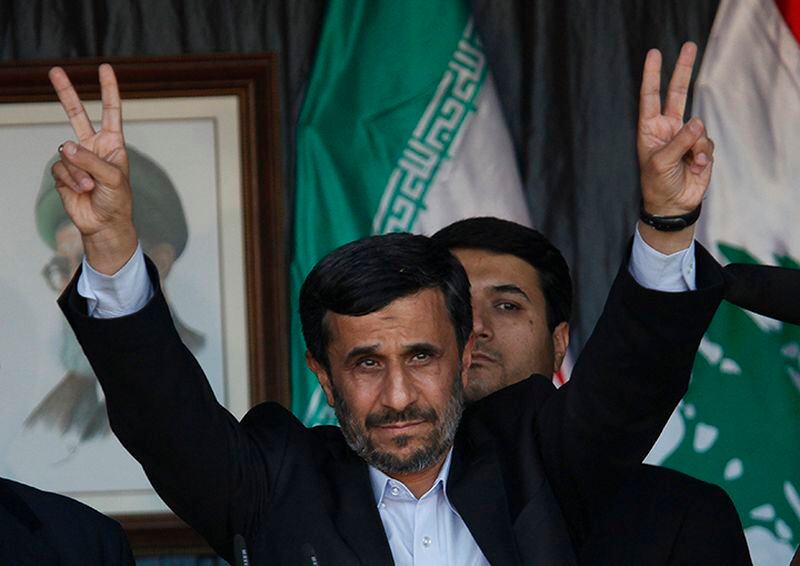 Iran's former President Mahmoud Ahmadinejad, flashes a V sign during a rally organized by Hezbollah in the southern border town of Bint Jbeil, Lebanon, on Thursday, Oct. 14, 2010. Thousands of Hezbollah supporters jammed a stadium in southern Lebanon Thursday ahead of a visit by Iranian President Mahmoud Ahmadinejad that will take him to within a couple miles of the Israeli border — a trip that the U.S. and Israel have called intentionally provocative.