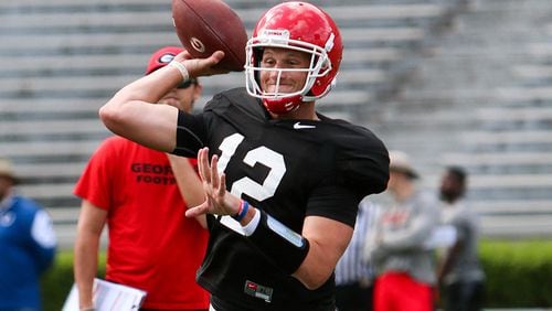 Georgia quarterback/punter Brice Ramsey (12) throws the ball during the Bulldogs' spring practice session Saturday, March 19, 2016, in Athens.