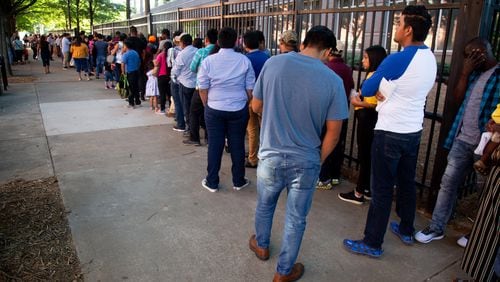 Long lines form outside the Atlanta Immigration Court Tuesday morning, July 2, 2019. STEVE SCHAEFER / SPECIAL TO THE AJC