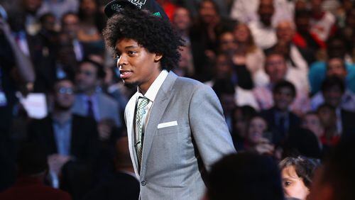 Lucas Bebe Nogueira (R) of Brazil walks through the green room towards the stage after he was drafted #16 overall in the first round by the Boston Celtics during the 2013 NBA Draft at Barclays Center on June 27, 2013 in in the Brooklyn Bourough of New York City.