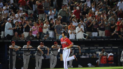 Andrelton Simmons jogs to home plate after hitting a homerun in the 5th inning during their game against the Arizona Diamondbacks at Turner Field on Friday, June 28, 2013. JOHNNY CRAWFORD / JCRAWFORD@AJC.COM