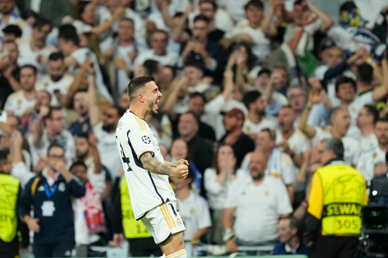 Real Madrid's Joselu celebrates after scoring his side's opening goal during the Champions League semifinal second leg soccer match between Real Madrid and Bayern Munich at the Santiago Bernabeu stadium in Madrid, Spain, Wednesday, May 8, 2024. (AP Photo/Jose Breton)