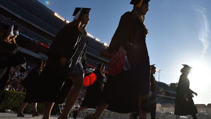 Students fill the University of Georgia’s Sanford Stadium for their 2016 graduation commencement. BRANT SANDERLIN/BSANDERLIN@AJC.COM